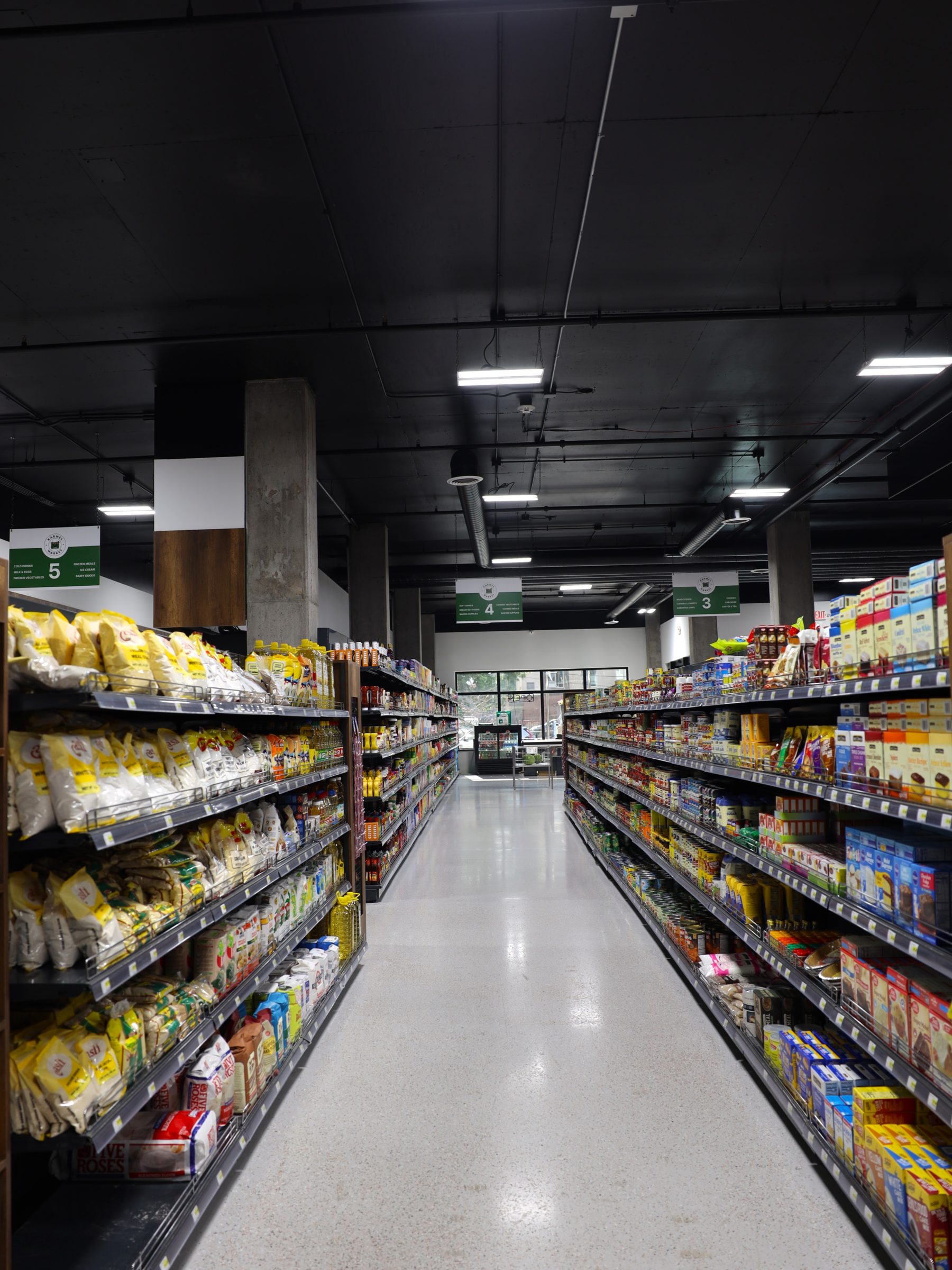 Stocked grocery aisle at Karmel Market