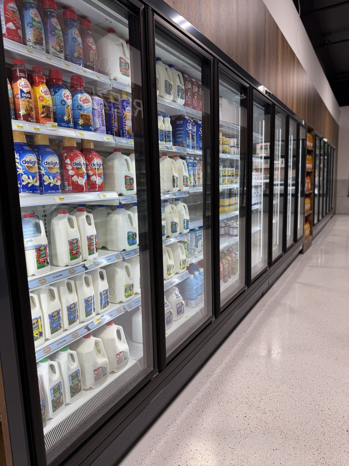 Refrigerated dairy case at Karmel Market