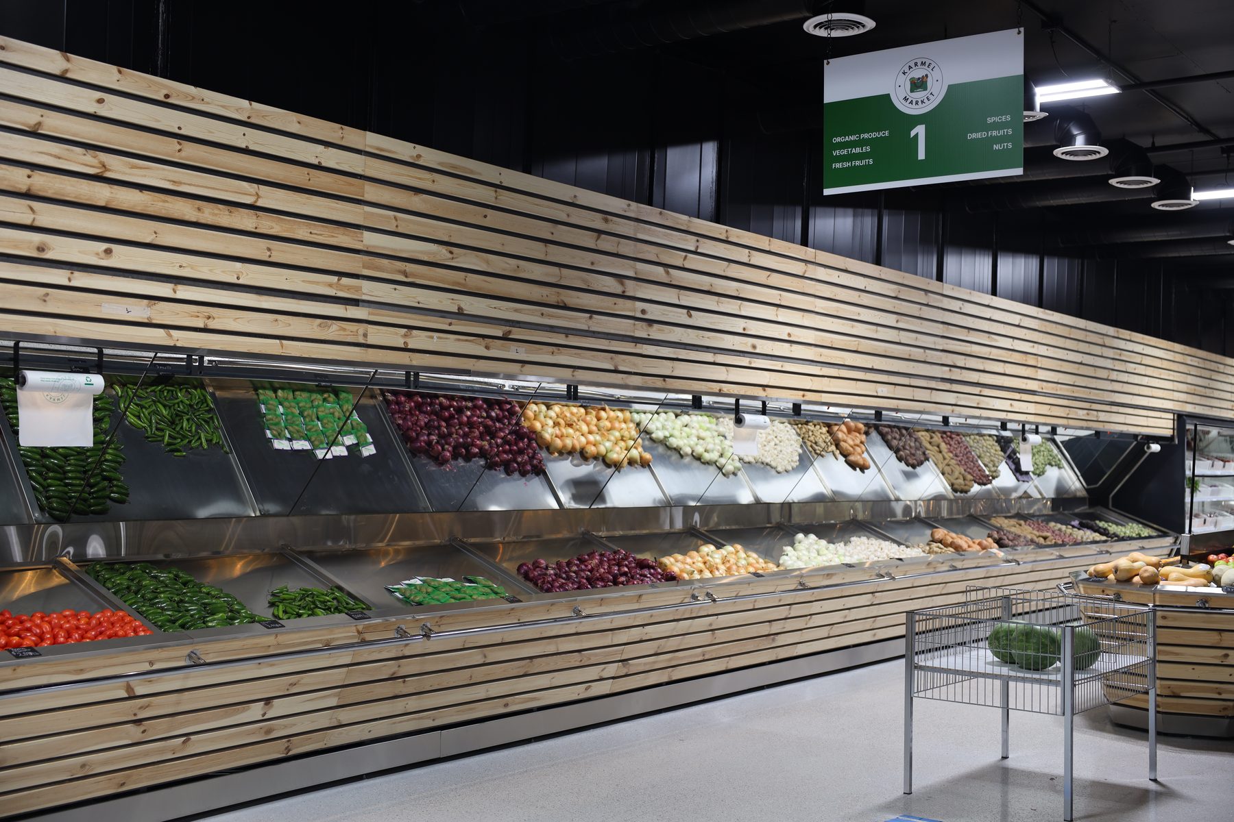 Fresh produce wall at Karmel Market